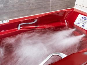 a red sink filled with lots of steam at APA Hotel Sapporo Housuisusukino Ekimae in Sapporo