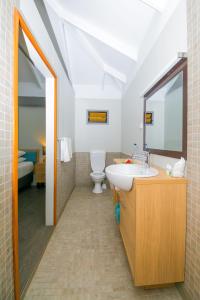 a bathroom with a sink and a toilet at Serenity Island Resort in Mamanuca Islands