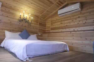 Postel nebo postele na pokoji v ubytování 心享庭園民宿 Wishes B&B