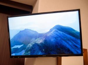 a television screen with a picture of a mountain at Hotel Trend Abeno Tennoji in Osaka +34 photos