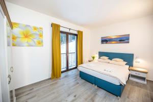 Postel nebo postele na pokoji v ubytování Spa & Wellness Hotel St. Moritz