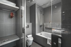 Vannituba majutusasutuses HARRIS Hotel & Conventions Malang