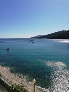 a large body of water with boats in it at Apartments Mare Losinjska 16 in Rabac