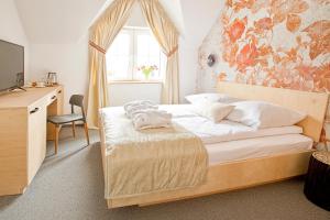 En eller flere senge i et værelse på Beskid Ski Villa