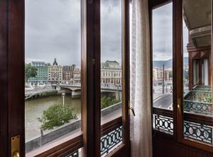 a view of a river from a window at Piso Señorial con vistas a la ria by Urban Hosts in Bilbao