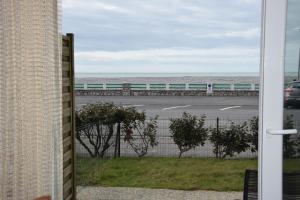 a view of the ocean from the balcony of a house at Ces jours en baie Le vue mer in Cayeux-sur-Mer