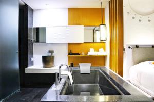 Veranda High Resort Chiang Mai - MGallery Collection客房内的一张或多张床位