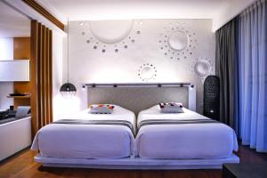 Veranda High Resort Chiang Mai - MGallery Collection客房内的一张或多张床位