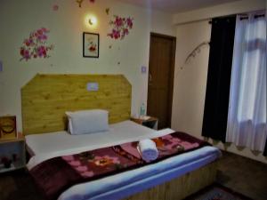 Cama o camas de una habitación en Manali Top Inn