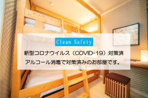 a bunk bed with a sign that reads clean safety at kaguya asakusa Women only guest house in Tokyo +36 photos