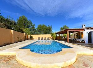 a swimming pool in the backyard of a house at Villa Iris - Plusholidays in Calpe