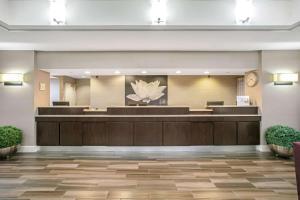 a lobby of a hotel with a waiting room at La Quinta by Wyndham DFW Airport South / Irving in Irving
