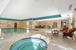 a large swimming pool in a hotel room at La Quinta by Wyndham Houston Willowbrook in Houston