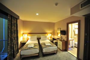 Cama o camas de una habitación en Yasmak Comfort Hotel