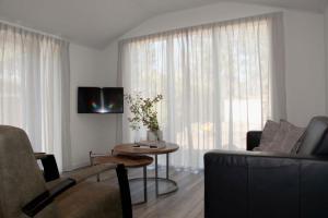 Area soggiorno di Huisjes Putten Reewold luxe chalet in rustige en mooie omgeving