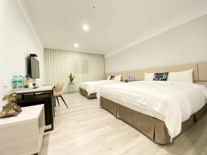 Voodi või voodid majutusasutuse Fengjia JinRui Hotel toas