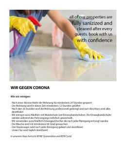 a woman in yellow rubber gloves cleaning the floor at Ferienwohnung Kopf in Bad Buchau