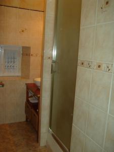 a shower stall in a bathroom with a sink at GITE MASKALI in Thenon +16 photos