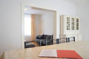 a living room with a table with a red book at House Hommert Hoensbroek in Hoensbroek +59 photos