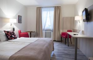 Postel nebo postele na pokoji v ubytování Hotel Excelsior