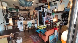 a living room with a couch and a table at Air Osaka Hostel in Osaka