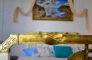 a close up of a gold object on a table at Errika's Sweet Home in Provatas