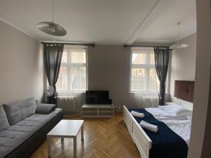Posteľ alebo postele v izbe v ubytovaní P&J Apartamenty Św. Krzyża