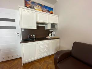 Kuchyňa alebo kuchynka v ubytovaní P&J Apartamenty Św. Krzyża