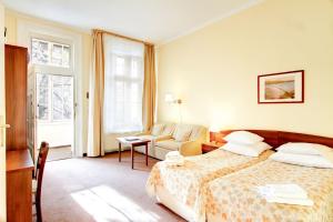 Posteľ alebo postele v izbe v ubytovaní P&J Apartamenty Św. Krzyża