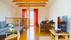 a living room with a couch and a table at Harz-Chill Wernigerode in Wernigerode
