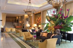 a lobby of a hotel with couches and chairs at Four Seasons Hotel Ritz Lisbon in Lisbon