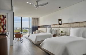 Postel nebo postele na pokoji v ubytování Four Seasons Resort Los Cabos