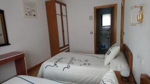 Posteľ alebo postele v izbe v ubytovaní Hostal "Los Chanos el Ruso"