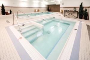 a large swimming pool in a large room at The Crimson Jasper in Jasper