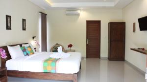 Ein Bett oder Betten in einem Zimmer der Unterkunft Darra Ria Villa Ubud