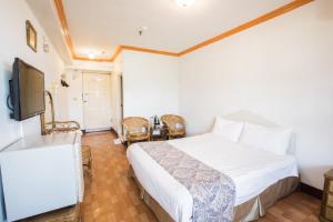 Telewizja i/lub zestaw kina domowego w obiekcie Kenting Maldives Hotspring Hotel
