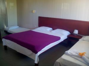 Postel nebo postele na pokoji v ubytování Hotel Nitana