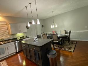 a kitchen and dining room with a table and a dining room at The La Grange House in Cleveland