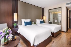 Uma cama ou camas num quarto em Minh Toan SAFI Ocean Hotel