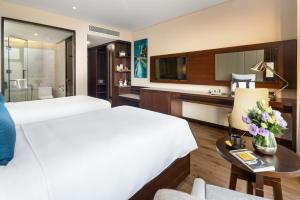 Uma cama ou camas num quarto em Minh Toan SAFI Ocean Hotel