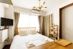 Ένα ή περισσότερα κρεβάτια σε δωμάτιο στο Maison d'Orme 503