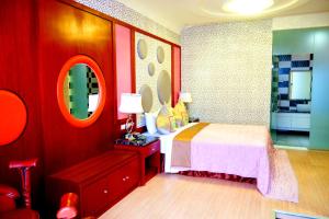 Postel nebo postele na pokoji v ubytování Zheng Yi Classic Hotel & Motel