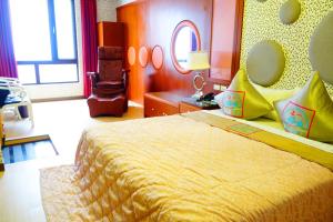 Postel nebo postele na pokoji v ubytování Zheng Yi Classic Hotel & Motel