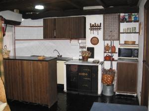 a kitchen with a sink and a stove top oven at Casa Turpesa in Peñalba de Santiago