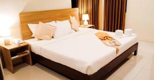 Postel nebo postele na pokoji v ubytování Rublin Hotel Cebu