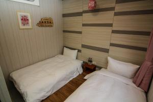 Postel nebo postele na pokoji v ubytování Mayu Hotel