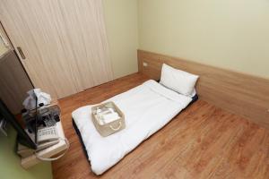 Postel nebo postele na pokoji v ubytování Mayu Hotel