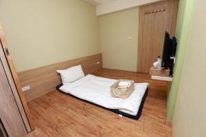 Postel nebo postele na pokoji v ubytování Mayu Hotel