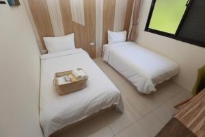 Postel nebo postele na pokoji v ubytování Mayu Hotel