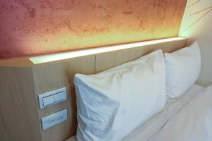 Postel nebo postele na pokoji v ubytování Mayu Hotel